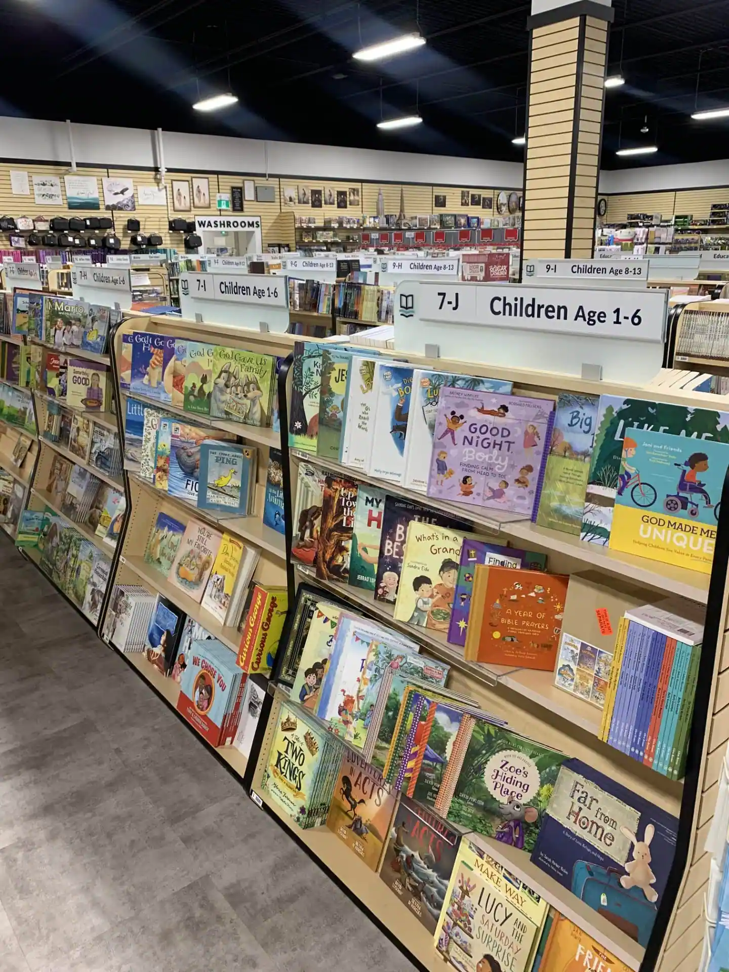 Shelves of children's books and gifts in the Living Waters store